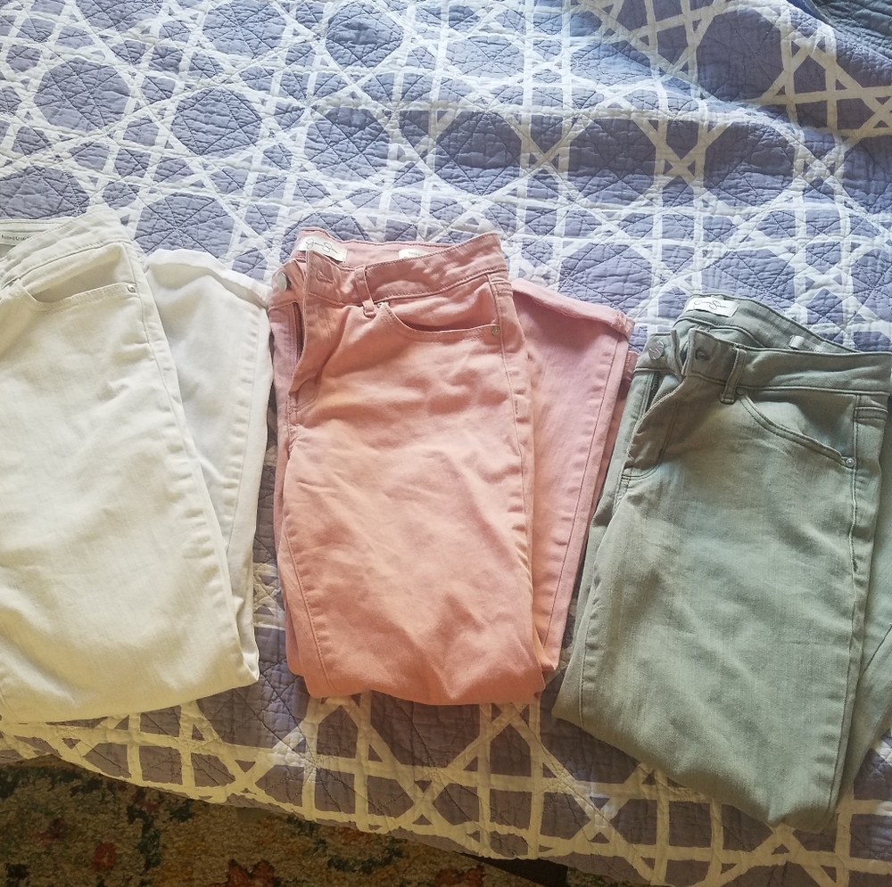 Bundle of cropped, rolled ankle jeans.